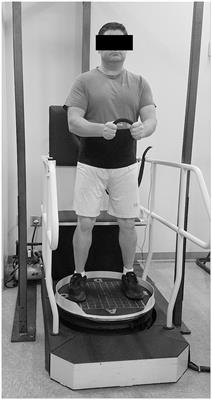 Lower extremity muscle activity during reactive balance differs between adults with chronic traumatic brain injury and controls